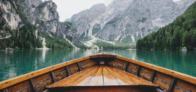 Boat on lake against mountains